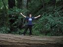 Maciej on fallen redwood bridge.